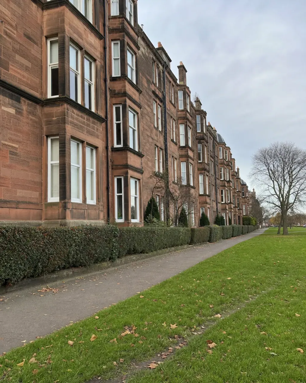 Red sandstone tenements facing the grass of Bruntsfield Links